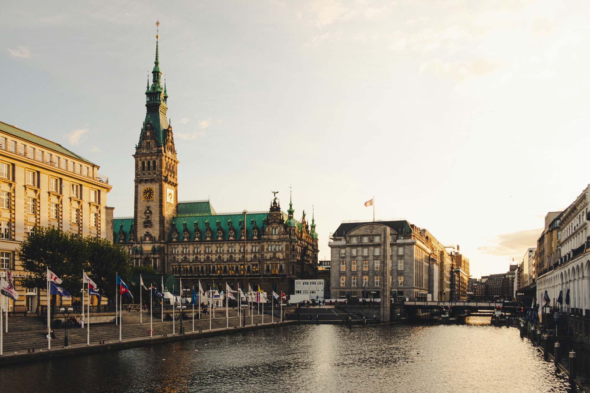 Hamburg city hall and the Kleine Alster at sunset